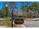 Laurel Brooke community entrance sign with lush landscaping, establishing the neighborhood's welcoming ambiance at 915 Laurel Brooke Ave, Peachtree City, GA 30269