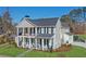 Elegant two-story home boasting a welcoming front porch and classic architectural details at 915 Laurel Brooke Ave, Peachtree City, GA 30269