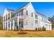 Charming exterior with a covered porch, attached garage, and well-manicured lawn at 915 Laurel Brooke Ave, Peachtree City, GA 30269