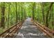 Scenic view of a tree-lined golf cart path, highlighting the community's recreational opportunities at 915 Laurel Brooke Ave, Peachtree City, GA 30269