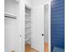 Hallway featuring mudroom with blue accent wall and closet at 915 Laurel Brooke Ave, Peachtree City, GA 30269
