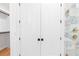 Hallway with closet, laundry, and bathroom access at 915 Laurel Brooke Ave, Peachtree City, GA 30269