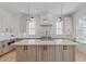 Spacious kitchen with quartz countertops, central island, and stainless steel appliances at 915 Laurel Brooke Ave, Peachtree City, GA 30269