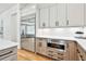 Modern kitchen features stainless steel refrigerator and built-in microwave at 915 Laurel Brooke Ave, Peachtree City, GA 30269