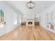 Bright living room featuring a fireplace and hardwood floors at 915 Laurel Brooke Ave, Peachtree City, GA 30269