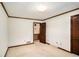 Bright bedroom with plush carpeting, wood trim and interior door at 95 Oak Grove Cir, Mcdonough, GA 30253