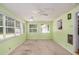 Bright bonus room with large windows, a ceiling fan, and access to other areas of the home at 95 Oak Grove Cir, Mcdonough, GA 30253