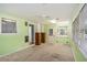 Sun-drenched bonus room featuring ample natural light, carpet, and a ceiling fan at 95 Oak Grove Cir, Mcdonough, GA 30253