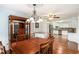 Dining area with hardwood floors and a view of the open kitchen area at 95 Oak Grove Cir, Mcdonough, GA 30253