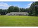 Single story home on a large lot with lush lawn and mature trees offering country living at 95 Oak Grove Cir, Mcdonough, GA 30253