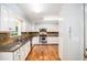 Traditional kitchen featuring granite countertops, stainless steel appliances, and hardwood floors at 95 Oak Grove Cir, Mcdonough, GA 30253