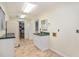 Well-lit utility room has a sink, cabinet space and tile flooring, perfect for laundry and extra storage at 95 Oak Grove Cir, Mcdonough, GA 30253