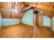 The attic boasts a wooden design, with a light, and with an exit door at 1975 Mack Rd, Douglasville, GA 30135