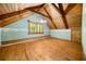 An attic featuring natural wood accents and a view from the window at 1975 Mack Rd, Douglasville, GA 30135