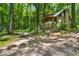 A view of the side of the house, surrounded by lush foliage at 1975 Mack Rd, Douglasville, GA 30135