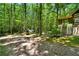 A view of the side of the house, located deep within the forest at 1975 Mack Rd, Douglasville, GA 30135