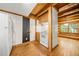 Charming kitchen featuring wooden beams, white appliances, and hardwood floors at 1975 Mack Rd, Douglasville, GA 30135