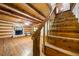 Living room with fireplace, wooden floors, and stairs to the second level at 1975 Mack Rd, Douglasville, GA 30135