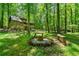 An exterior view of the outdoor fire pit area of the home at 1975 Mack Rd, Douglasville, GA 30135