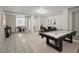 Open basement area including dining and a pool table at 240 W Lake Nw Dr, Atlanta, GA 30314