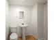 Small bathroom with a single sink and tiled shower at 240 W Lake Nw Dr, Atlanta, GA 30314