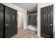 Bathroom with tile flooring, a shower-over-tub, and storage space at 240 W Lake Nw Dr, Atlanta, GA 30314
