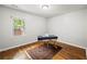 Bright bedroom with hardwood floors, natural light, and a blue desk at 240 W Lake Nw Dr, Atlanta, GA 30314