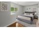 Modern bedroom with large windows, hardwood floors, and comfortable decor at 240 W Lake Nw Dr, Atlanta, GA 30314