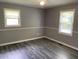 Bright bedroom featuring a ceiling fan and windows for natural light at 6471 Ansley Blvd, Lithia Springs, GA 30122