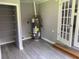 A utility room featuring storage shelving, an electric water heater, and a door at 6471 Ansley Blvd, Lithia Springs, GA 30122