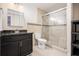 Modern bathroom featuring a glass door shower, vanity, and toilet at 157 Spur Ln, Hiram, GA 30141
