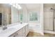 Bright bathroom with dual sinks, soaking tub and separate shower at 157 Spur Ln, Hiram, GA 30141