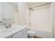 Bright bathroom with a single sink vanity, toilet, and a shower-tub combo at 157 Spur Ln, Hiram, GA 30141