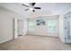 Spacious bedroom with tray ceilings, ceiling fan and double doors leading to additional room at 157 Spur Ln, Hiram, GA 30141