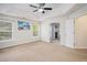 Large bedroom with tray ceilings and a ceiling fan at 157 Spur Ln, Hiram, GA 30141