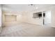 Open living area with new carpet, recessed lighting, and a functional wet bar at 157 Spur Ln, Hiram, GA 30141