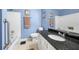 Stylish bathroom featuring a white vanity with a dark countertop and a shower-tub combo at 1901 Brittania Cir, Woodstock, GA 30188