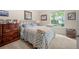 Comfortable bedroom with neutral tones and a window offering natural light at 1901 Brittania Cir, Woodstock, GA 30188