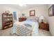 Inviting bedroom featuring a cozy bed and carpet, enhanced by natural light and a ceiling fan at 1901 Brittania Cir, Woodstock, GA 30188