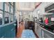 Bright kitchen boasts stainless steel appliances, dark wood cabinets, and hardwood floors flowing into an open floor plan at 1901 Brittania Cir, Woodstock, GA 30188