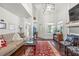 Comfortable living room features a fireplace, hardwood floors, a view of the staircase and a neutral decor at 1901 Brittania Cir, Woodstock, GA 30188