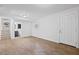 Finished basement with laminate flooring, and access to stairs and the entry door at 1971 Hooper St, Decatur, GA 30032