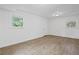 Finished basement features laminate wood-look flooring and natural light at 1971 Hooper St, Decatur, GA 30032
