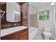 Bathroom featuring a vanity, mirror, sink, toilet and tiled shower/tub at 1971 Hooper St, Decatur, GA 30032