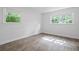 Bright room with wood-look floors, fresh paint, and a sunny window at 1971 Hooper St, Decatur, GA 30032