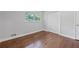 A bedroom with hardwood floors, natural light from the windows, and a closet at 1971 Hooper St, Decatur, GA 30032