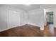 Bright bedroom features a closet, hardwood floors and a connecting door at 1971 Hooper St, Decatur, GA 30032