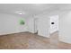 Spacious bedroom featuring wood-look floors, fresh paint, and a large window at 1971 Hooper St, Decatur, GA 30032