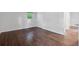 A spacious bedroom with hardwood floors, natural light, and a view of the yard at 1971 Hooper St, Decatur, GA 30032