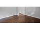 Cozy bedroom with hardwood floors, white trim and two doors at 1971 Hooper St, Decatur, GA 30032